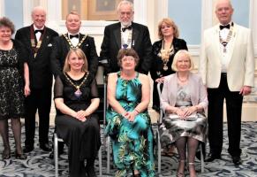 Rosalind Hopewell, President of Llandudno Rotary (standing, R) enjoyed here evening with Llandudno Lions